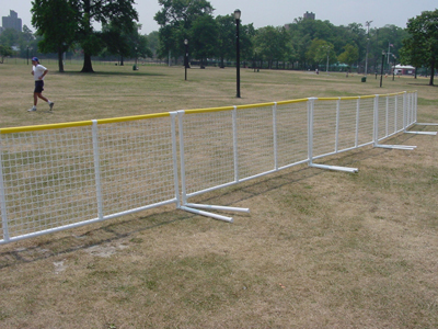 Chain Link Fences Afford Security to People and Player in Baseball Court